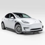 A wide view of Vorsteiner VRS Add-On Aero Fender Vents Carbon Fiber PP 2x2 Glossy on a white car (for Model Y). 
