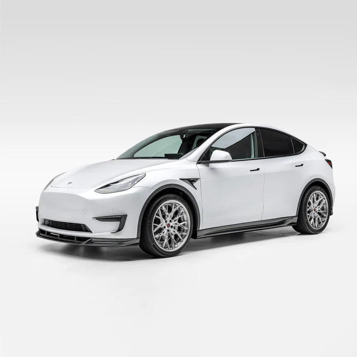 A wide view of Vorsteiner VRS Add-On Aero Fender Vents Carbon Fiber PP 2x2 Glossy on a white car from the side (for Model Y). 