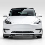 A look of Vorsteiner VRS Aero Front Spoiler Carbon Fiber PP 2x2 Glossy on a white car from the front (for Model Y).
