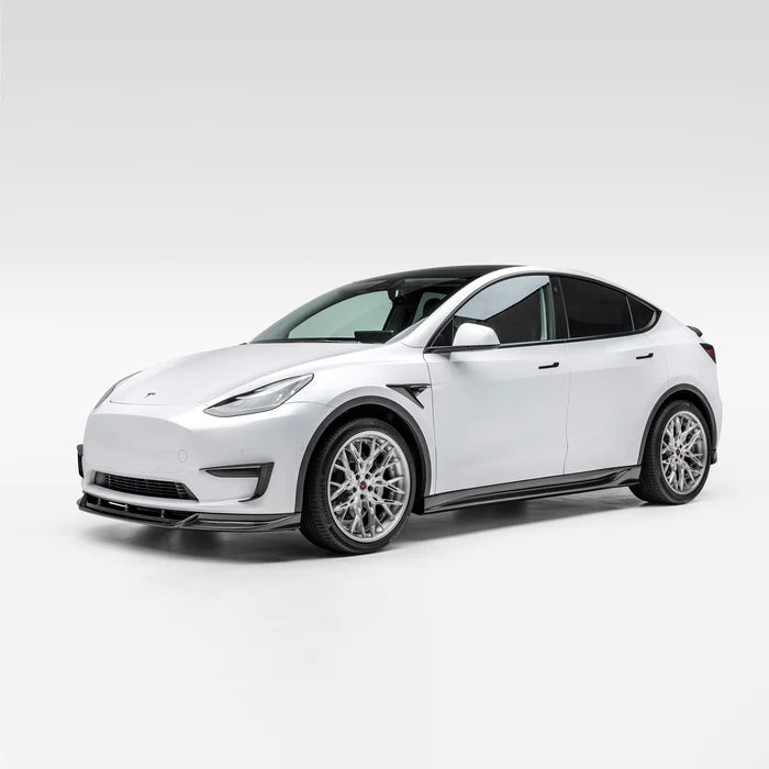 A wide side view of Vorsteiner VRS Aero Front Spoiler Carbon Fiber PP 2x2 Glossy on a white car (for Model Y).