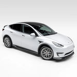 A wide side view of Vorsteiner VRS Aero Front Spoiler Carbon Fiber PP 2x2 Glossy on a white car (for Model Y).