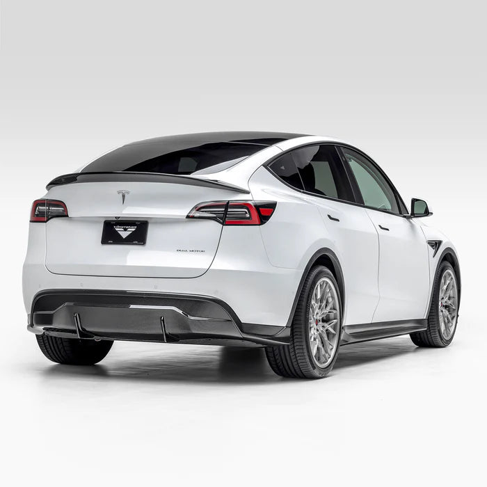 A wide side view of Vorsteiner VRS Aero Rear Diffuser Carbon Fiber PP 2x2 Glossy fitted on white car from behind (for Model Y).