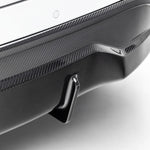 A close view of Vorsteiner VRS Aero Rear Diffuser Carbon Fiber PP 2x2 Glossy fitted on white car (for Model Y).