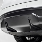 A close view of Vorsteiner VRS Aero Rear Diffuser Carbon Fiber PP 2x2 Glossy fitted on white car (for Model Y).