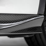 A close up view of Vorsteiner VRS Aero Side Skirts Carbon Fiber PP 2x2 Glossy (for Model Y).