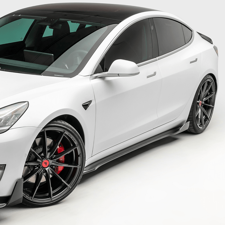 wide front side view of TRE Vorsteiner Style Carbon Fibre VOLTA Aero Side Skirt For Tesla Model 3 2018+ fitted inside a car