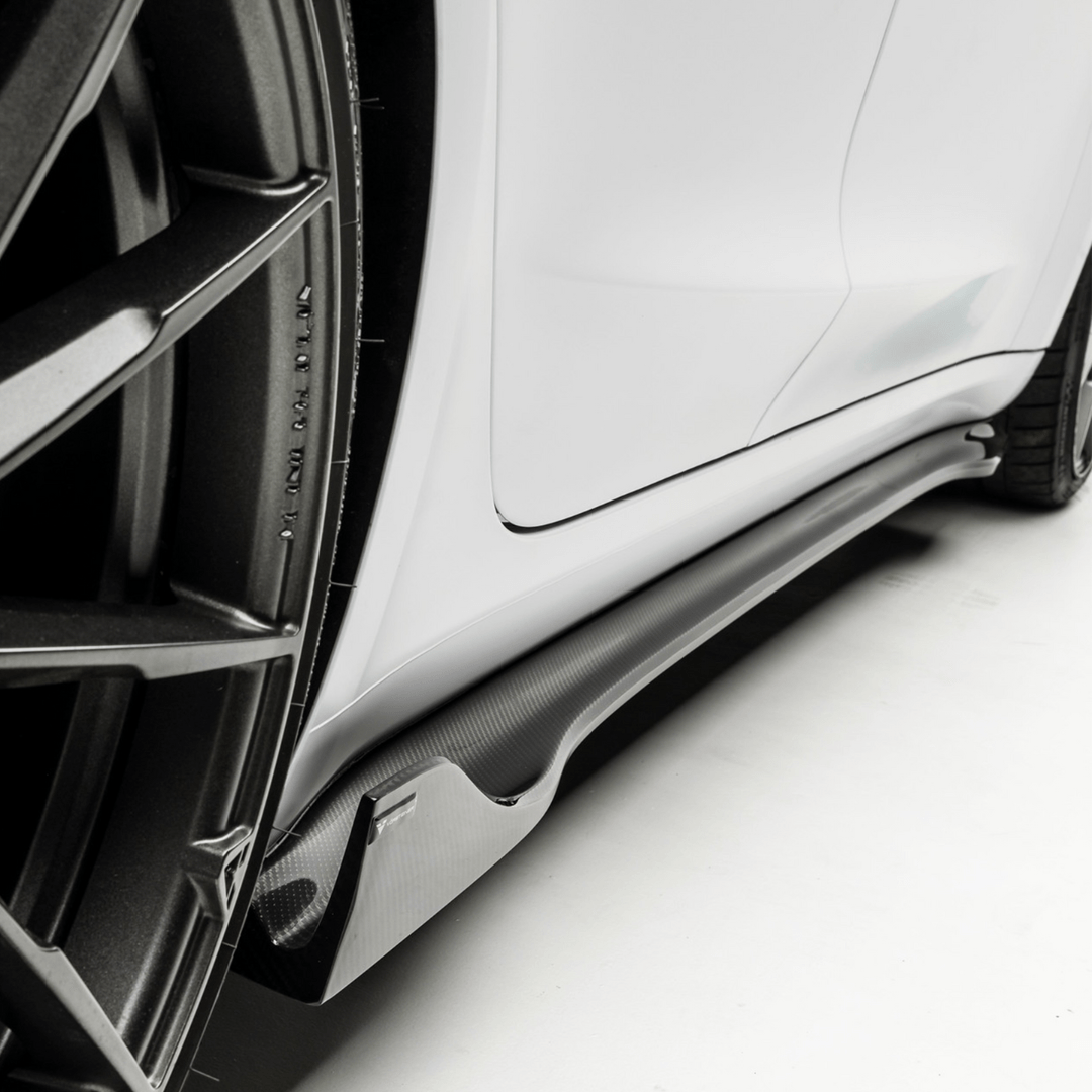 close bottom side view of TRE Vorsteiner Style Carbon Fibre VOLTA Aero Side Skirt For Tesla Model 3 2018+ fitted inside a car