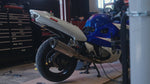 Valvetronic Designs Motorcycle Valved Muffler manufacturer gallery: muffler installed beside the rear wheel of a motorcycle