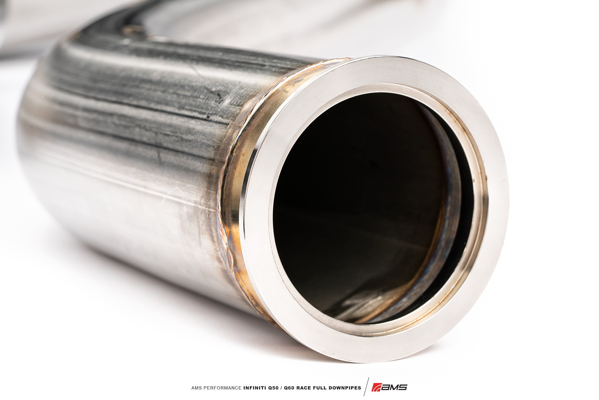 Outlet end of an AMS 3-inch stainless full downpipe showing the flange and smooth inner bore