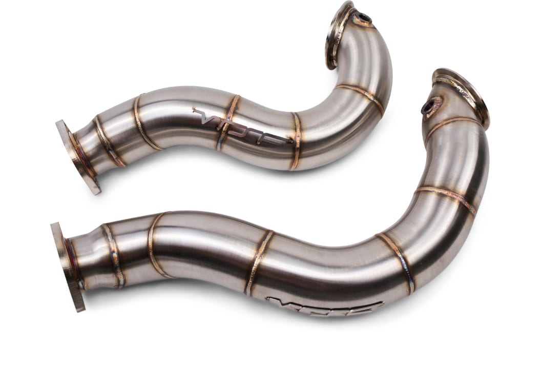 Pair of VRSF Z4 35i N54 downpipes laid flat, 3in TIG-welded 304 stainless