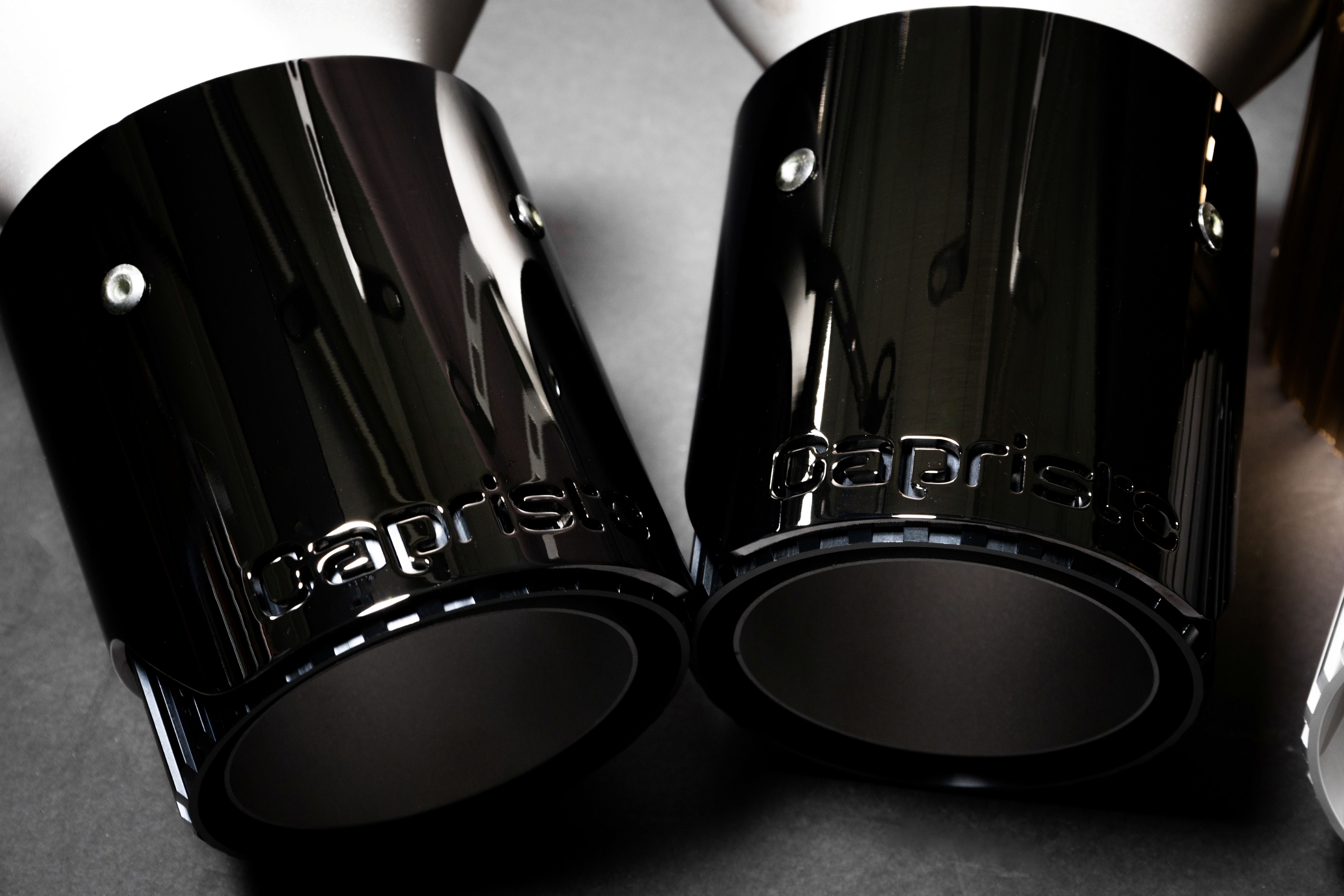 Pair of mirror-black Capristo SF90 tips with logo