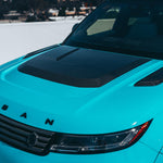 Close-up of the Urban carbon Powerdome hood on a blue Range Rover Sport L461