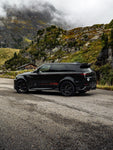 Black Range Rover Sport L461 with the Urban XRS Widetrack program in the mountains
