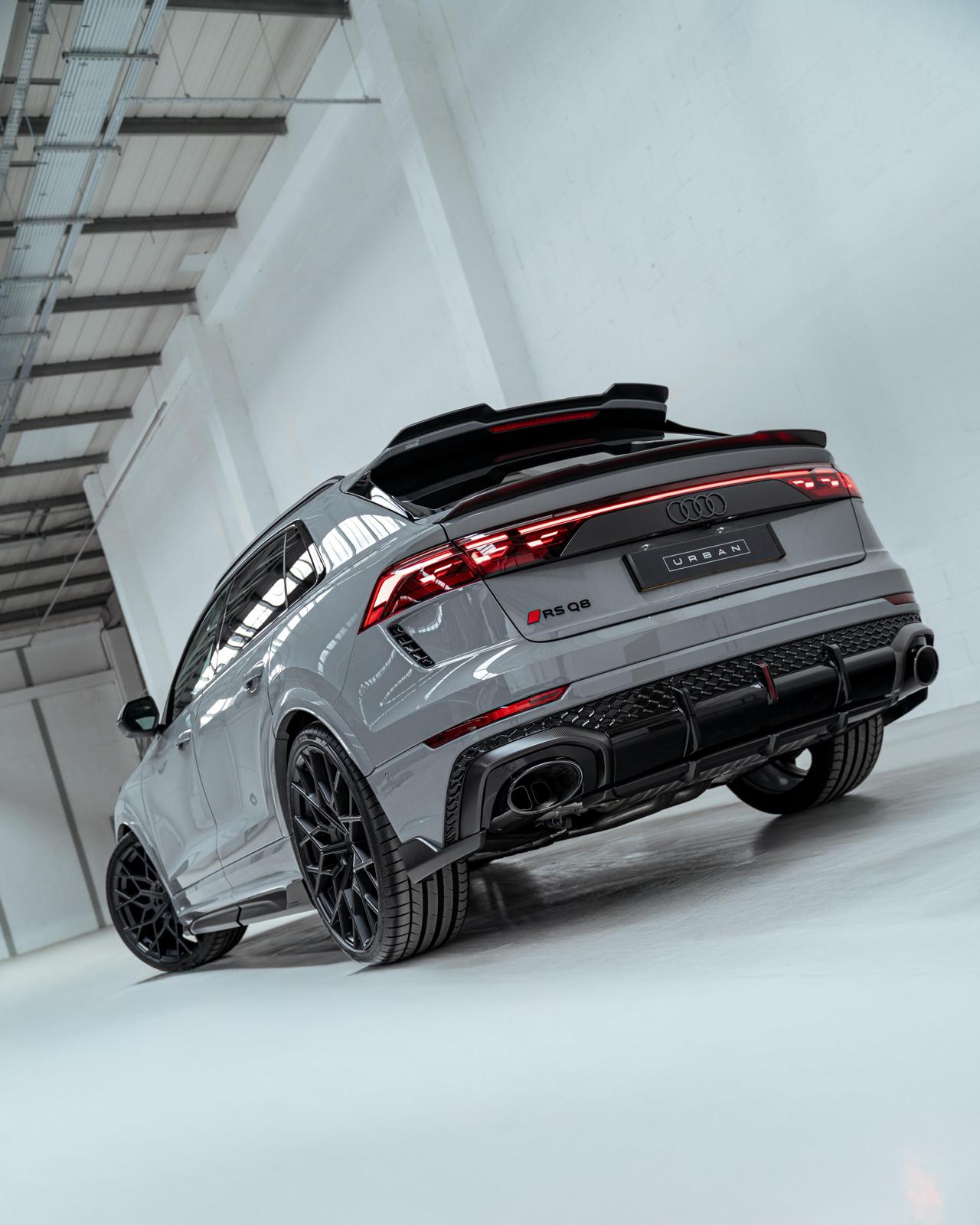 Rear three-quarter view of the Urban carbon diffuser and spoilers on an Audi RS Q8 facelift