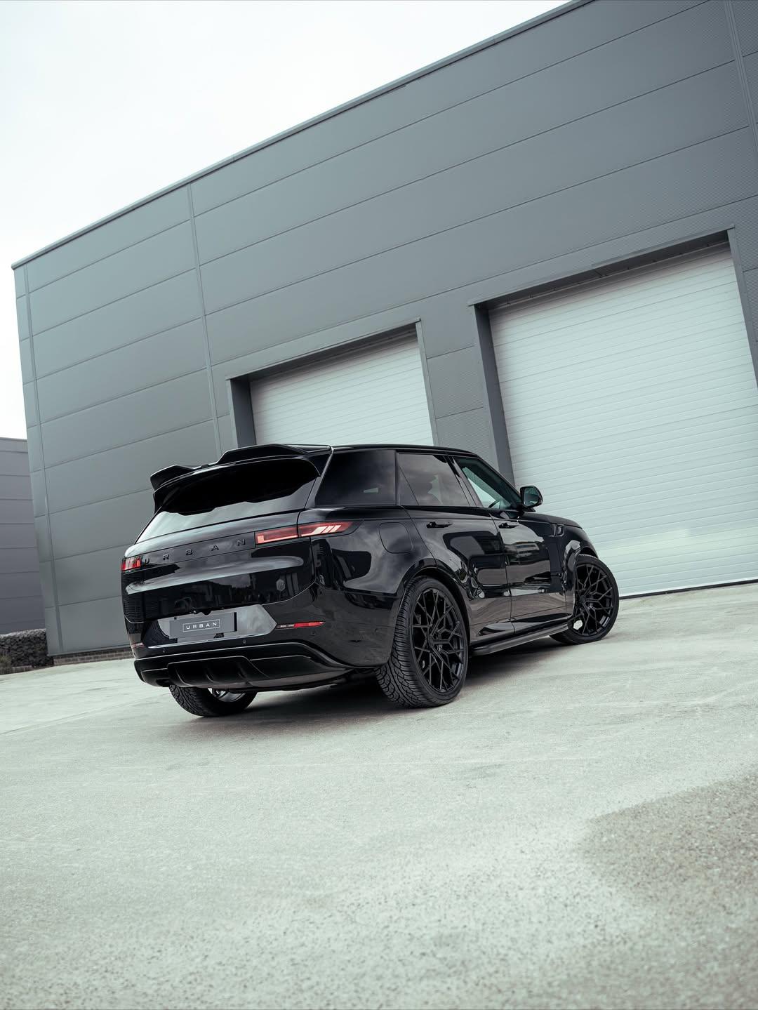 Rear three-quarter view of a black Range Rover Sport L461 with the Urban Aero Kit