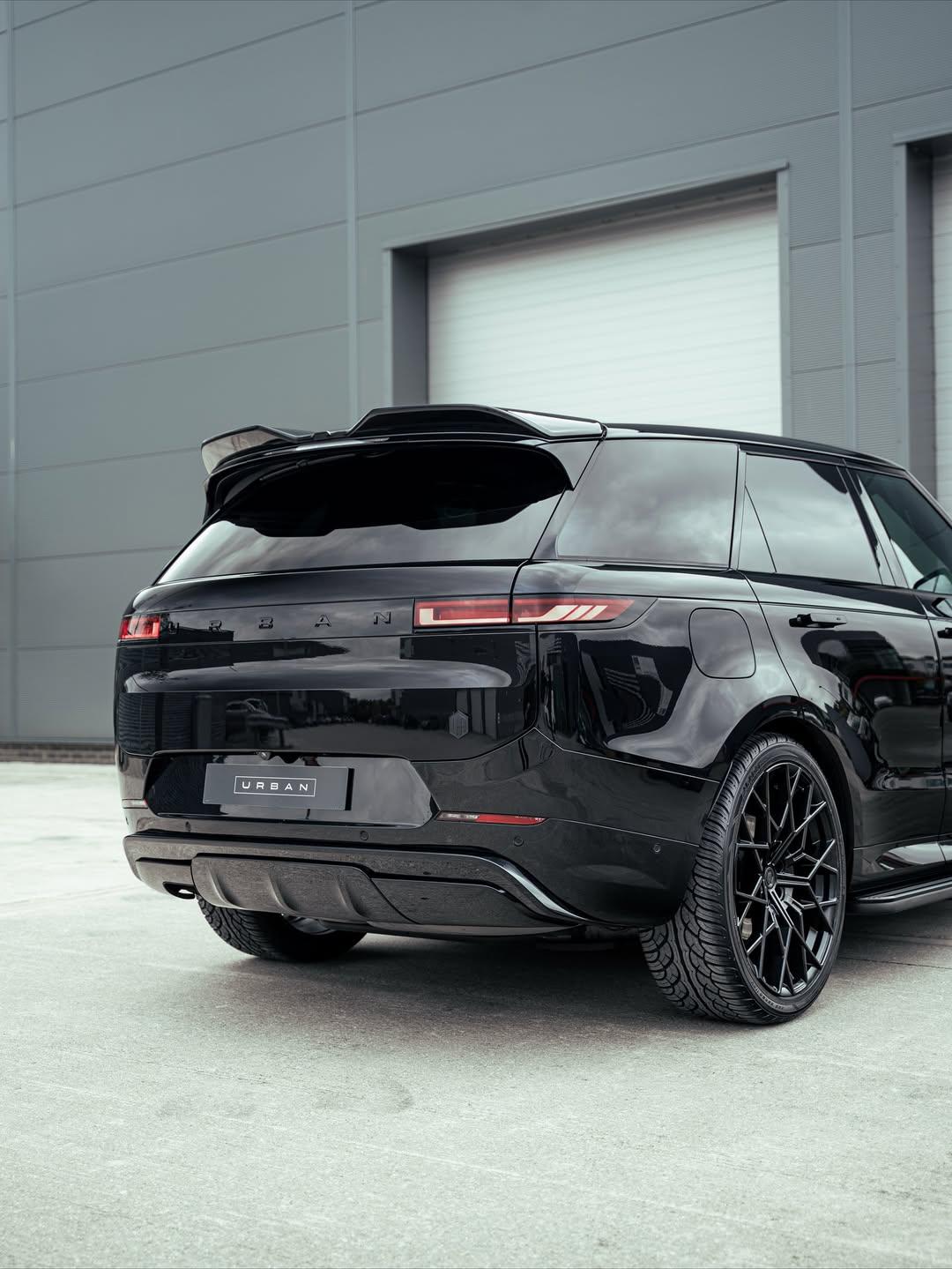 Rear view of a Range Rover Sport L461 with the Urban gloss black rear spoiler