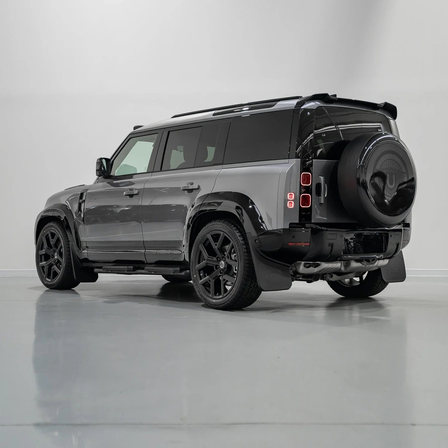Urban Widetrack fender arch fitted over the front wheel of a Land Rover Defender 110