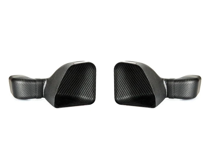 A front view of AUTOTECKNIC DRY CARBON INTAKE AIR DUCT SET - BMW G80 M3 | G82/ G83 M4 2020+ with white background
