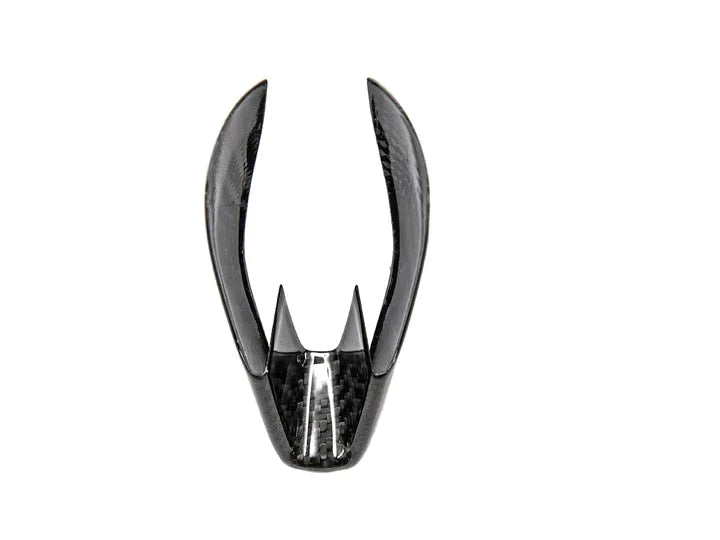 A front view of AUTOTECKNIC DRY CARBON GEAR SELECTOR COVER for BMW Models with white background
