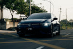 Dark Volkswagen Golf R Mk8 on the road, front view