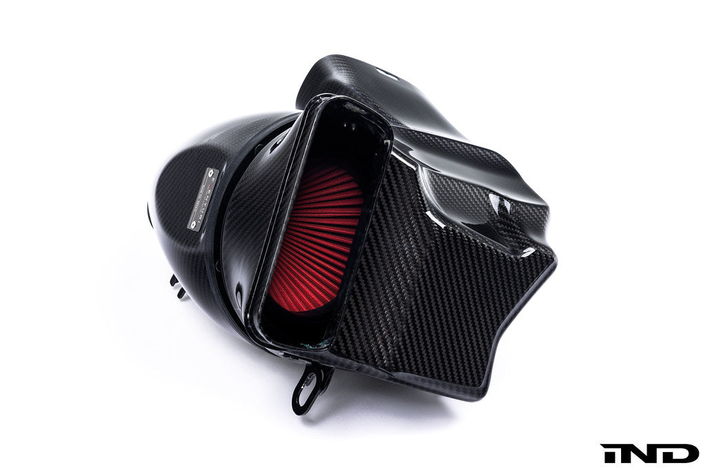 A side view of Eventuri Black Carbon Intake System For BMW F9X X5M / X6M / G09 XM with white background