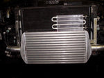 A close up view of Evolution Racewerks Audi A4 (B5) Competition Series Front Mount Intercooler (FMIC) Kit fitted on a car