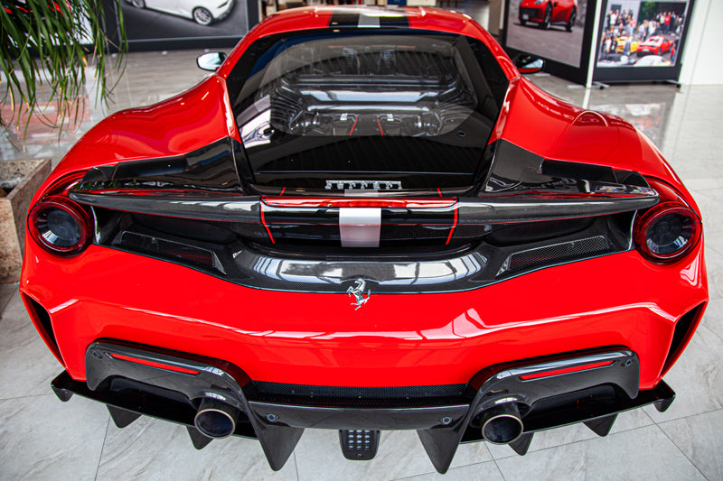 Close-up of Capristo carbon fiber diffuser strakes on Ferrari 488 Pista