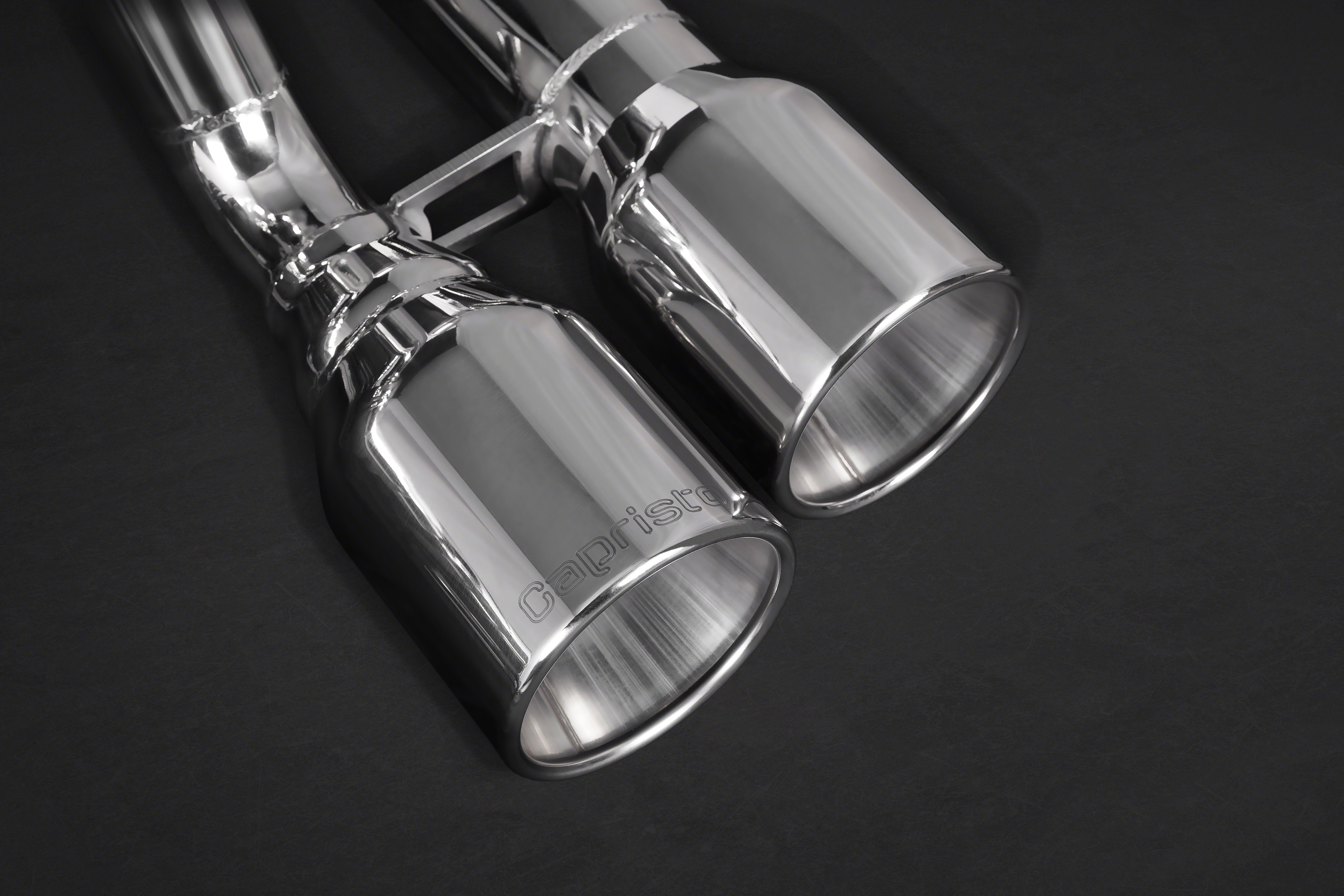 Close-up of polished round twin tips with logo on the Capristo BMW M2 F87 exhaust