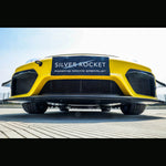 Low front-angle view of yellow track sports car showing exposed carbon fiber underbody panel edge below the front fascia and air intakes - SilverRocket Ultra Downforce Front Aeroshield Porsche 718 GT4 RS