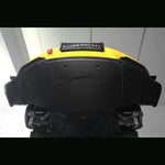 Underbody view of yellow sports car's front section with installed dry carbon fiber aeroshield panel showing visible twill weave covering the OEM aluminum tub - SilverRocket Ultra Downforce Front Aeroshield Porsche 718 GT4 RS
