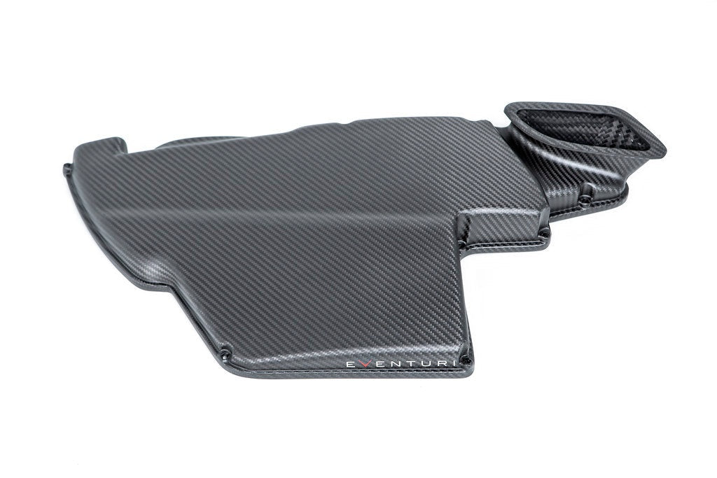 Carbon fiber airbox lid with textured weave finish, curved shape with mounting tabs and integrated air duct - Eventuri airbox lid for BMW M3