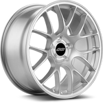Silver alloy wheel with multi-spoke design, machined finish, and center cap with black circle on white background - APEX Wheels wheel for 19x9 ET30 5x120 - Race Silver