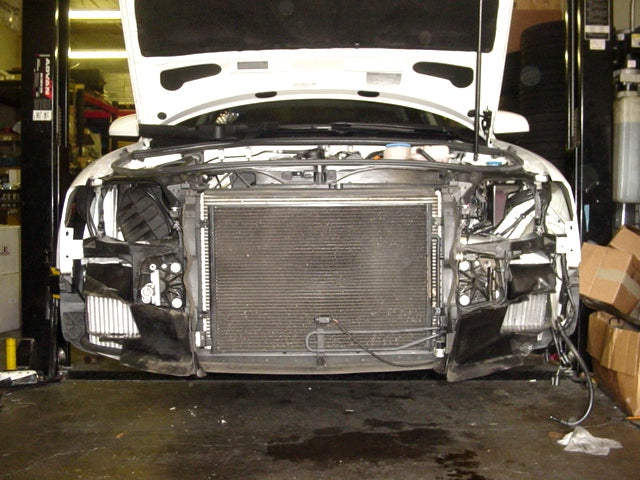 A front view of Evolution Racewerks Audi A4 (B7) Sports Series Dual Side Mount Intercooler (SMIC) Upgrade Kit installed in a lifted car