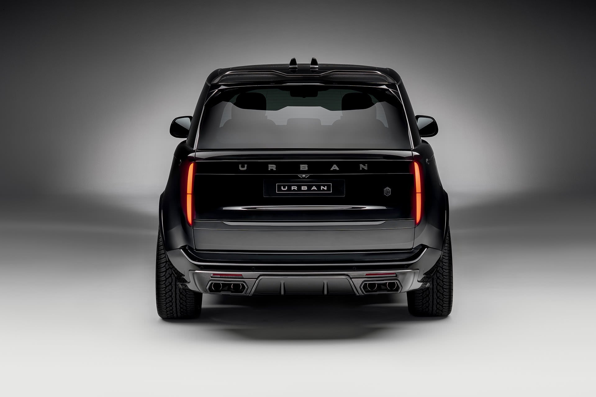 Rear of a Range Rover L460 Urban Widetrack: carbon diffuser, skid pan and URBAN lettering