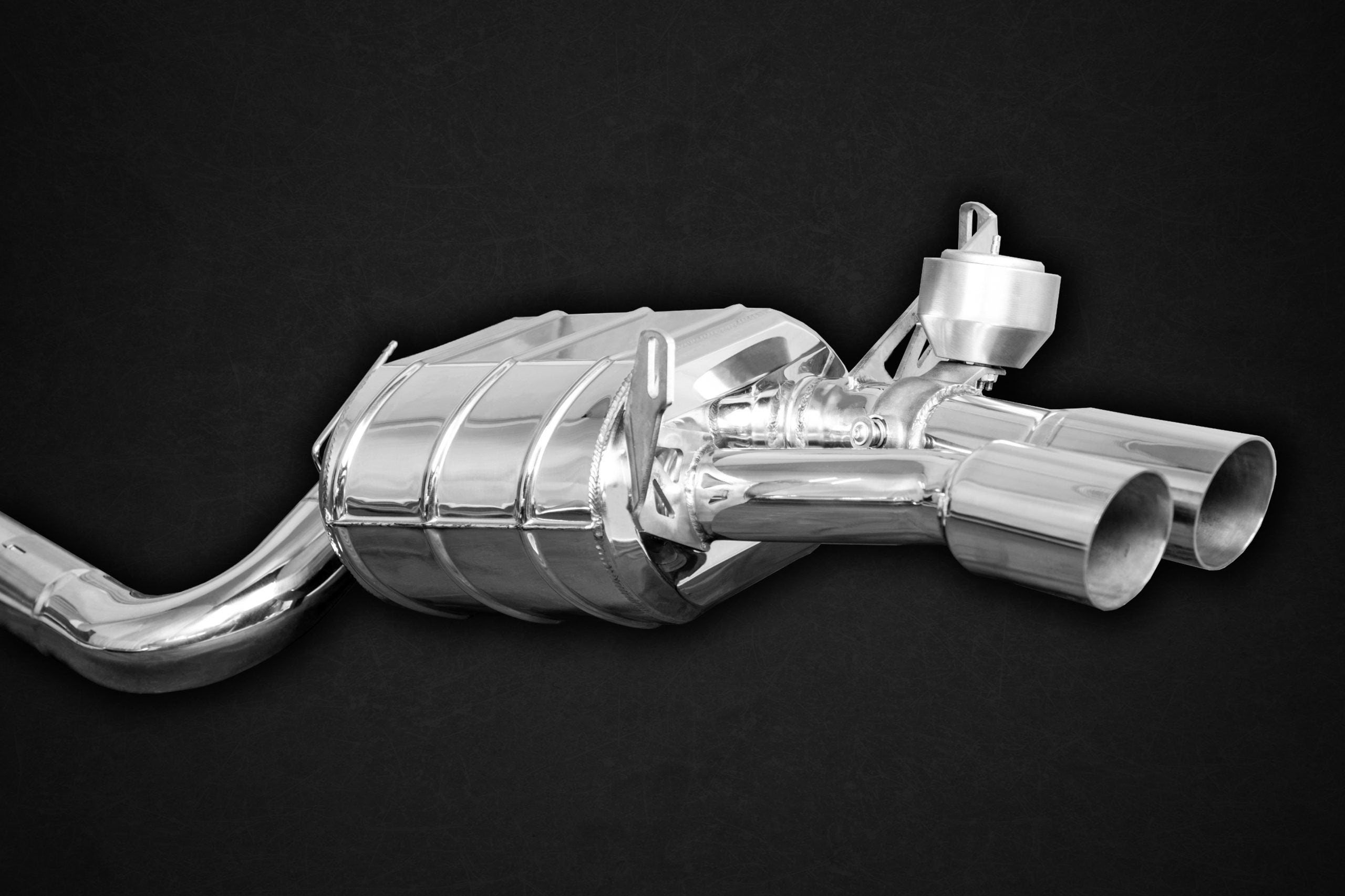 Close-up of Capristo polished valved muffler with dual round tips for Maserati GranSport