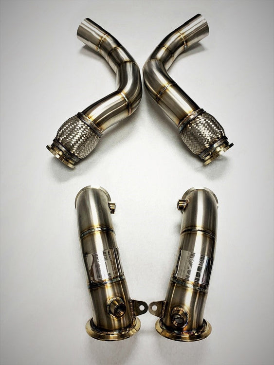 A top view of Evolution Racewerks Sports Series High Flow Catted Downpipe BMW M5/M8 S63M Engine Kit in Brushed Finish