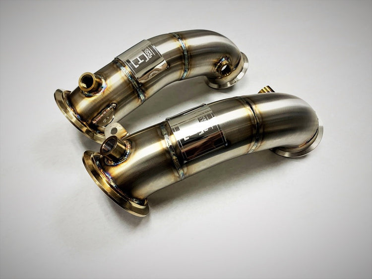 A top view of Evolution Racewerks Competition Series Catless Primary Downpipe BMW X5M/X6M S63M Engine in Brushed Finish