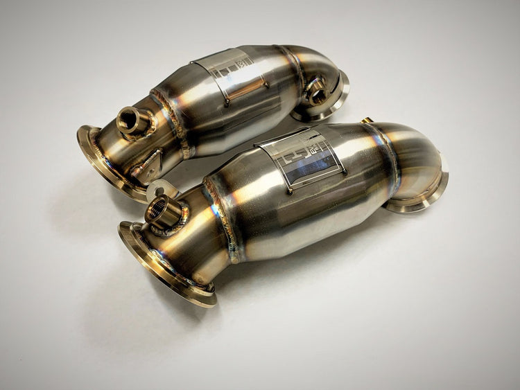 A top view of Evolution Racewerks Sports Series High Flow Catted Primary Downpipe for BMW X5M/X6M S63M Engine in Brushed Finish