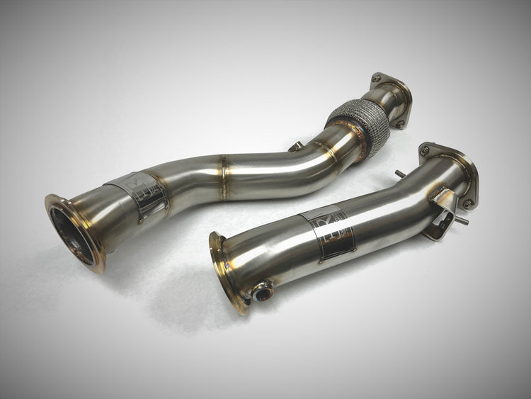 A top view of Evolution Racewerks Competition Series Catless Downpipes BMW G80 M3/ G82 M4 2021 + in Brushed Finish