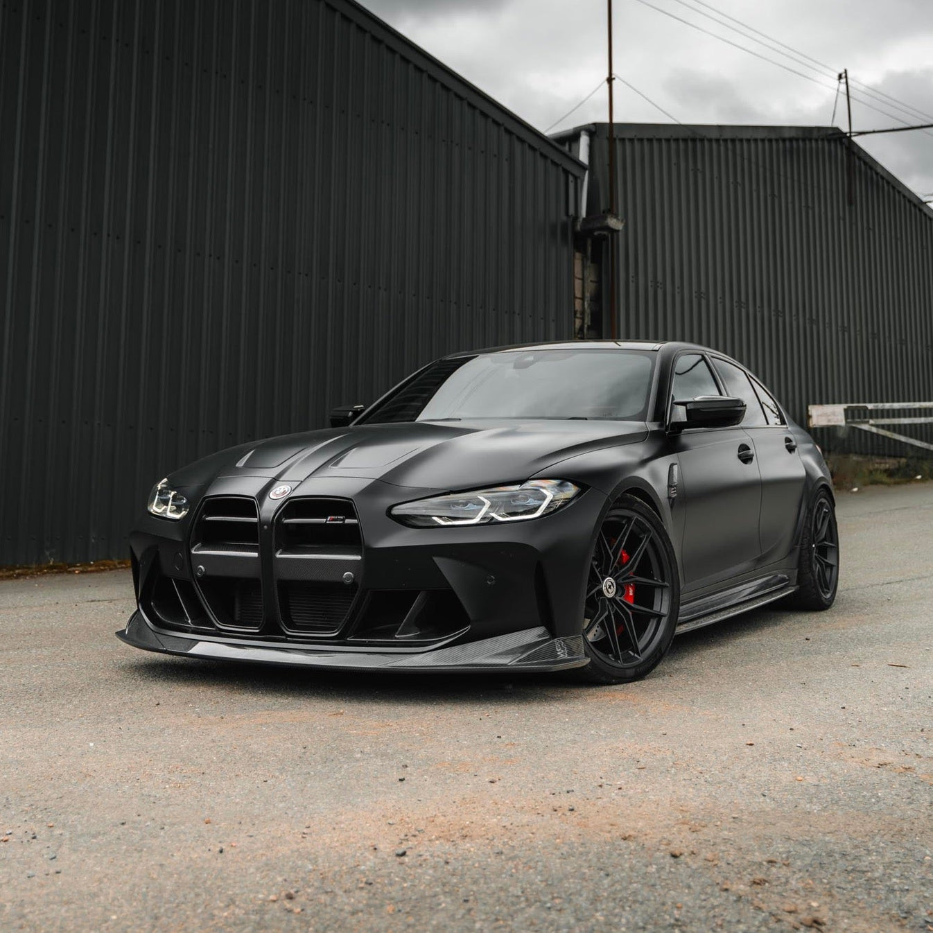 Wide front view of TRE PR-1 Pre-Preg Carbon Fibre Body Kit for BMW M3 G80 2020+ fitted inside a car