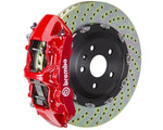 A front view of Brembo GT Front Big Brake Kit 380x34 6-Piston Drilled Rotors for Volkswagen Tiguan R (Mk2) in red caliper with white background