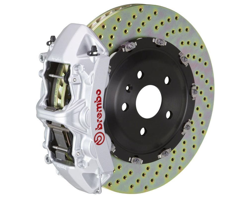A front view of Brembo GT Front Big Brake Kit 380x34 6-Piston Drilled Rotors for Audi S3 (8Y) in silver caliper with white background