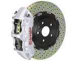 A front view of Brembo GT Front Big Brake Kit 380x34 6-Piston Drilled Rotors for Volkswagen Tiguan R (Mk2) in silver caliper with white background
