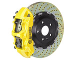 A front view of Brembo GT Front Big Brake Kit 380x34 6-Piston Drilled Rotors for Audi S3 (8Y) in yellow caliper with white background