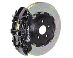 A front view of Brembo GT Front Big Brake Kit 380x34 6-Piston Slotted Rotors for Volkswagen Golf R (Mk8) in black caliper with white background