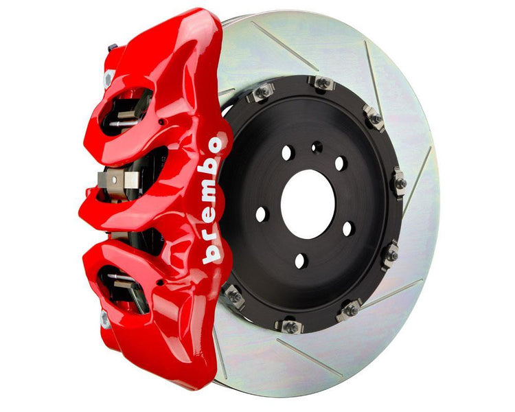 A front view of Brembo GT Front Big Brake Kit 380x34 6-Piston Slotted Rotors for Audi S3 (8Y) in red caliper with white background