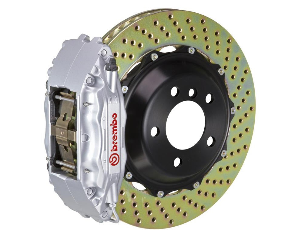 A front view of Brembo GT Front Big Brake Kit 355x32 2-Piece 4-Piston Drilled Rotors for Porsche 993 C2 / C4 in Silver caliper with white background