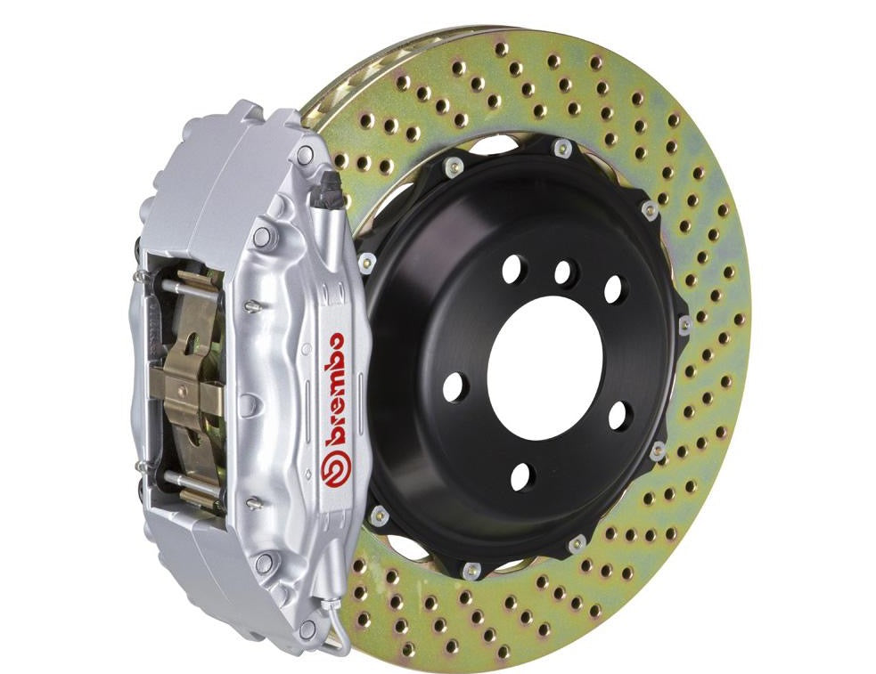 A front view of Brembo GT Front Big Brake Kit 332x32 2-Piece 4-Piston Drilled Rotors for Porsche 993 C2 / C4 in Silver with white background