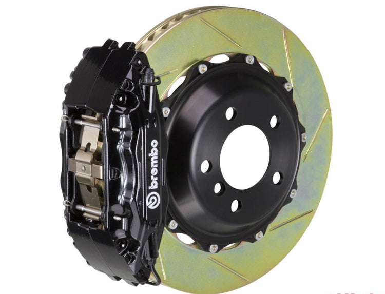 A front view of Brembo GT Front Big Brake Kit 332x32 2-Piece 4-Piston Slotted Rotors for Porsche 993 C2 / C4 in Black Caliper with white background