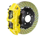 A front view of Brembo GT Front Big Brake Kit 355x32 2-Piece 6-Piston Drilled Rotors for Porsche 993 C2 / C4 in yellow caliper with white background